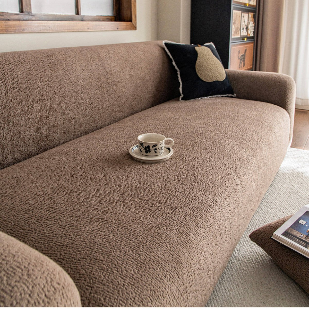 Warm brown stretch sofa cover — home lifestyle